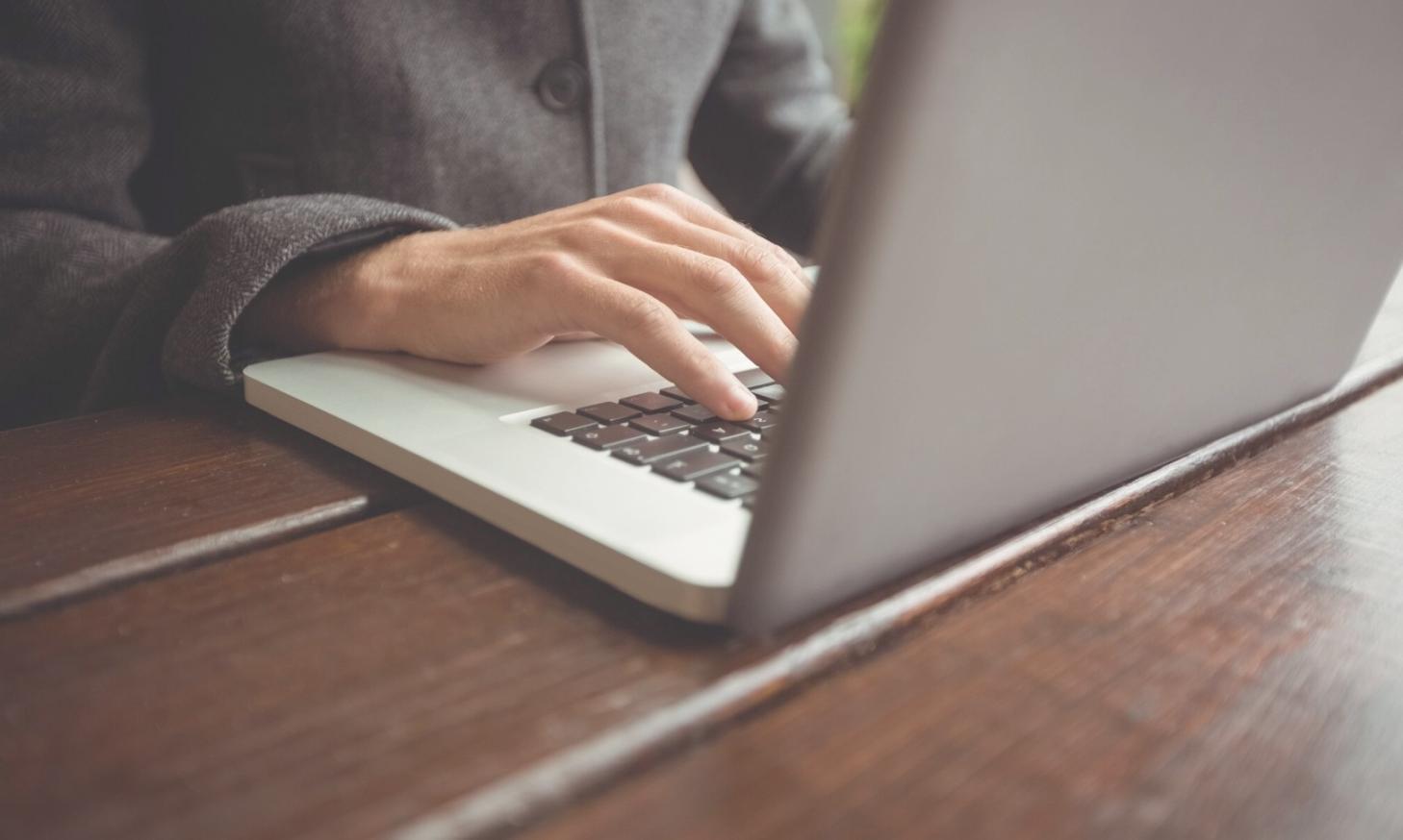 Professional reviewing financial documents and planning materials on desk